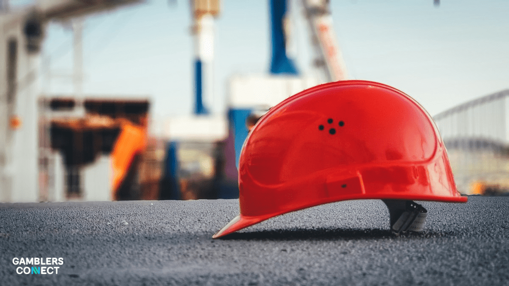 A safety hard hat representing the crucial work of building a secure iGaming ecosystem to protect players from harm, as detailed by Gamecheck and BetBlocker.