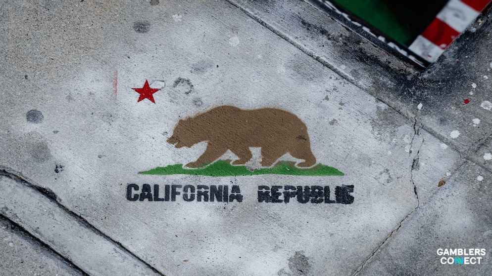 A stylized image of the California state flag, symbolizing the ongoing legislative debate over the legality of DFS and sweepstakes in the state.