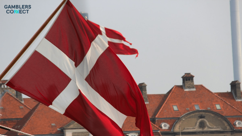 A flag of Denmark, symbolizing the nation's iGaming market where online casino GGR surged by 40% year-over-year in May 2025.