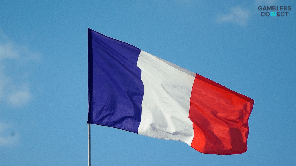 The flag of France, symbolizing the country's strict regulatory environment as the ANJ penalizes a gaming operator for non-compliance with data archiving rules.
