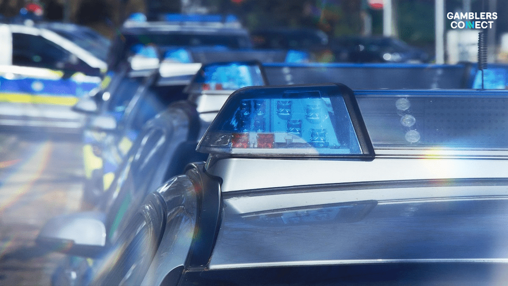 A close-up of police cars, representing the law enforcement crackdown on the Akasia899 and Tanjung899 illegal gambling websites.
