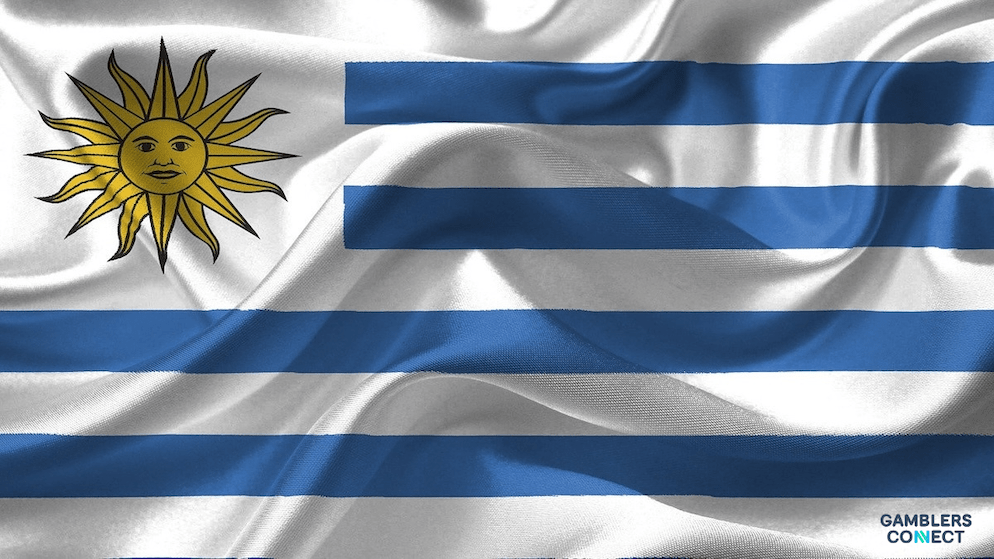 The flag of Uruguay, highlighting the focus of a new partnership between SCCG and Crowe to improve regulatory standards in the nation's gaming industry.