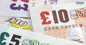 A close-up of UK Pound Sterling banknotes, representing the £11 million in transitional funding allocated to GambleAware under the new statutory RET levy.