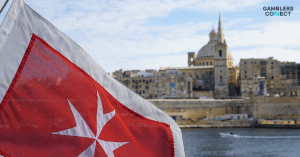 A view of the Valletta, Malta skyline with the Maltese flag in the foreground, representing 3 Oaks Gaming's successful acquisition of a Recognition Notice from the Malta Gaming Authority (MGA).