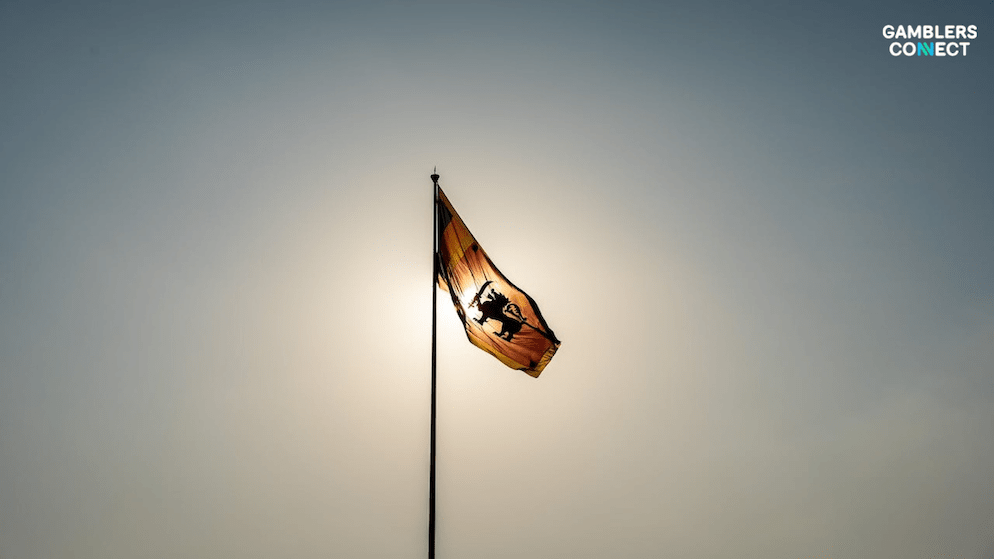 The flag of Sri Lanka silhouetted against the sun, symbolizing the national government which is facing criticism over its failure to pass the Gambling Regulatory Authority Bill.