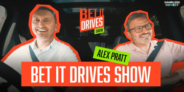 Host Yevhen Krazhan and guest Alex Pratt in a car for the "Bet It Drives" iGaming podcast, with the London skyline in the background.