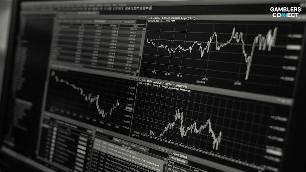 Financial data and graphs on a monitor, representing Codere Online's reported NGR of €54.8m for Q2 2025, primarily driven by the Mexican market.