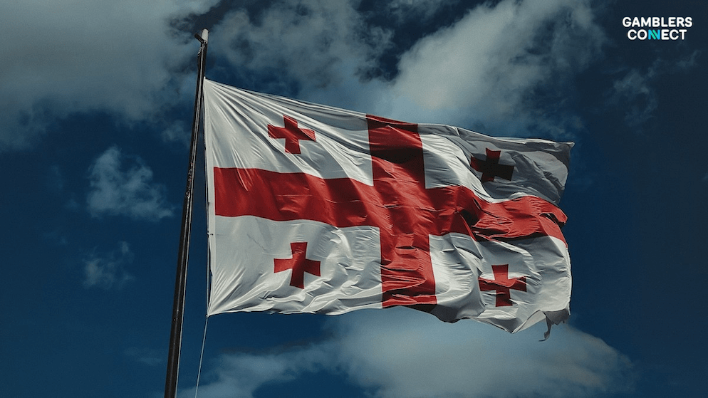 The flag of Georgia waving against a cloudy sky, representing the country's gambling self-exclusion database which has now exceeded 30,000 registrants.