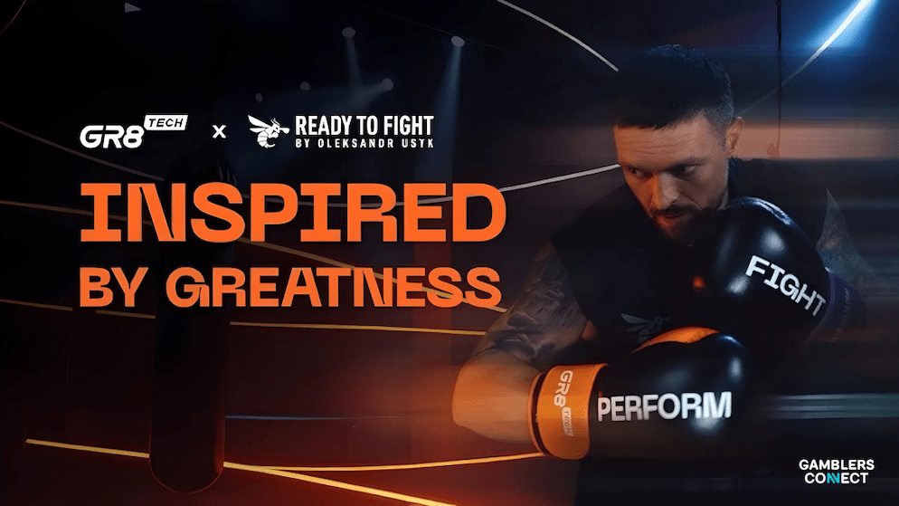 Heavyweight boxer Oleksandr Usyk wearing boxing gloves that say "FIGHT" and "PERFORM," featured in a promotional image for GR8 Tech and Ready to Fight.
