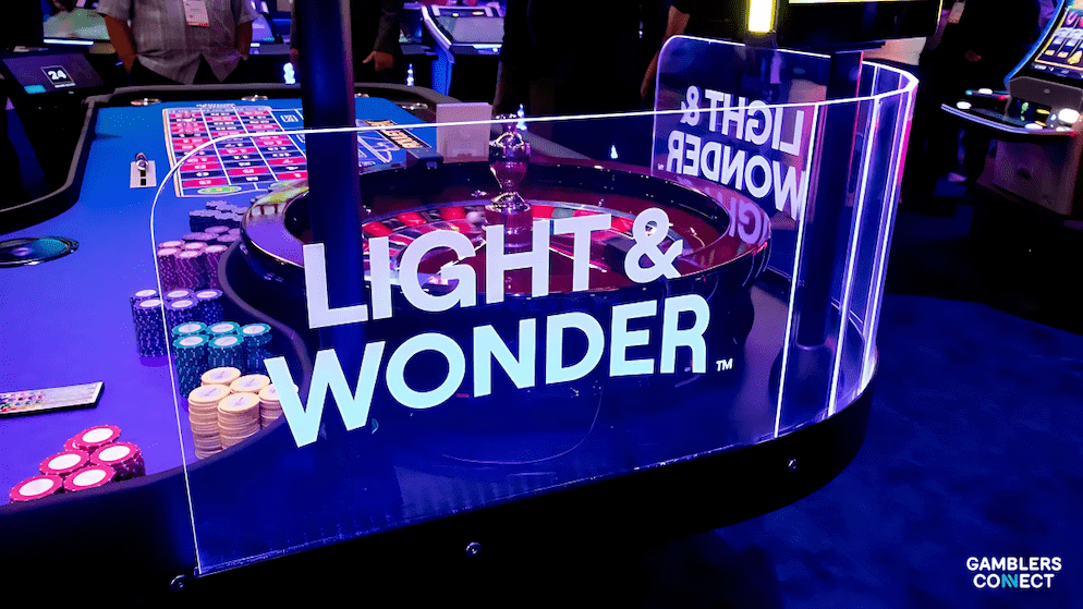 A close-up of a Light & Wonder electronic roulette table with casino chips, visually representing their gaming segment's performance in the second quarter of 2025 financial results.