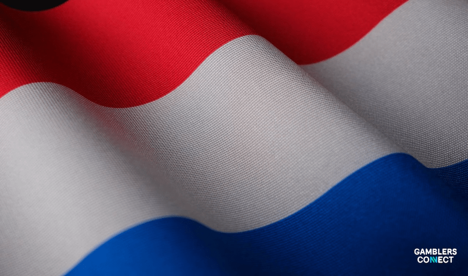 A softly blurred image of the waving Dutch flag, symbolizing the national context of the Kansspelautoriteit (KSA), the country's gaming regulatory body that has expanded its Advisory Board.