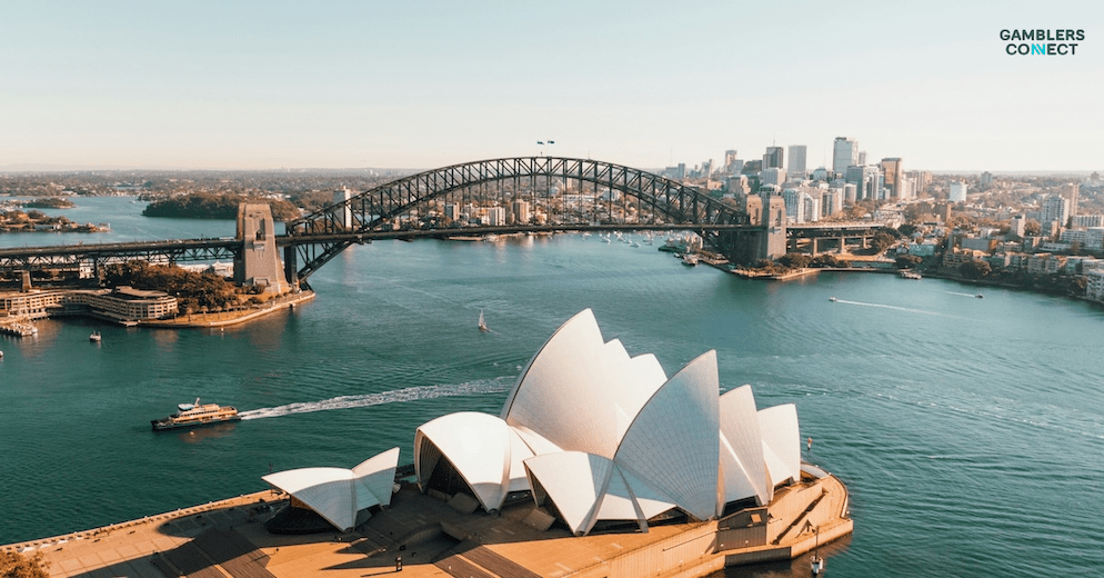 A scenic shot of Sydney Harbour with the bridge and opera house, representing the Australian context of the PointsBet acquisition by Mixi, highlighting the location of the company involved in the bidding war with Betr.