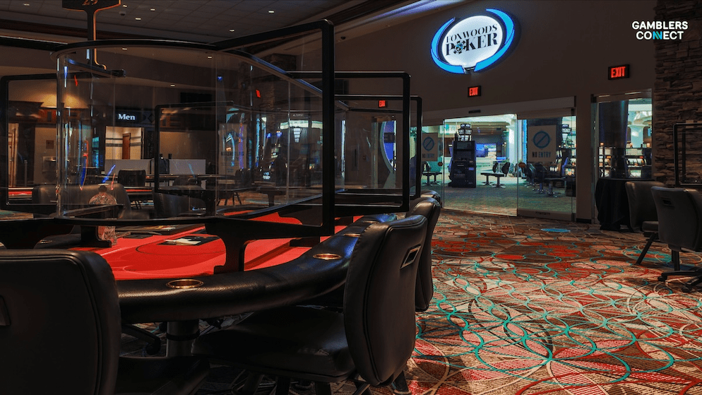 A view of a modern and luxurious poker room, with professional-grade tables and comfortable seating, representing the new facility opening at Foxwoods Resort Casino.