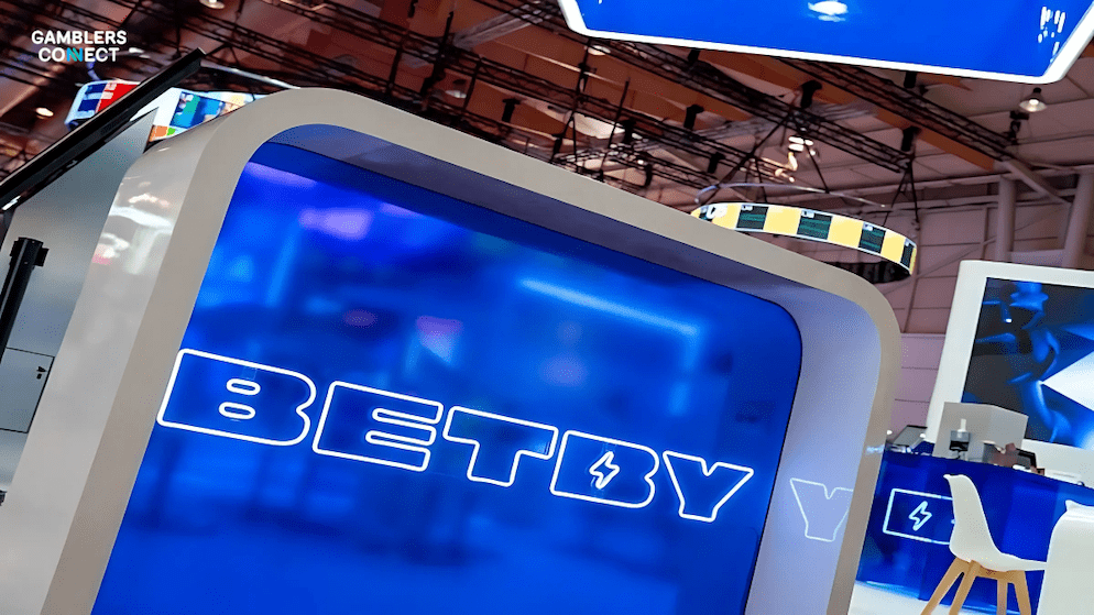 The Betby logo on a vibrant blue display, representing the company's advanced AI Labs and esports betting technology integrated by partners like Broadway Platform.
