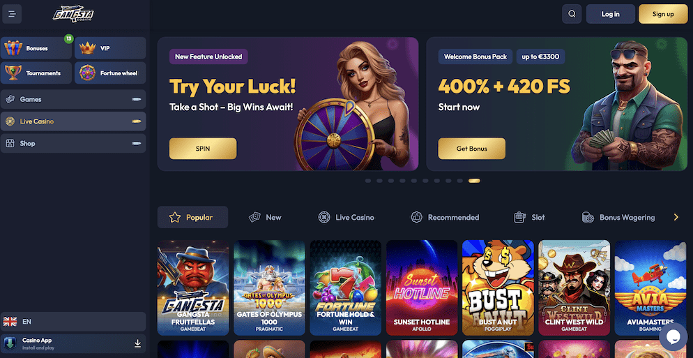 The homepage of Gangsta Casino, showcasing its dark, mobster-themed design. The main banner displays a "Welcome Bonus Pack" of 400% + 420 Free Spins, alongside a promotional image for a "Fortune wheel" feature.