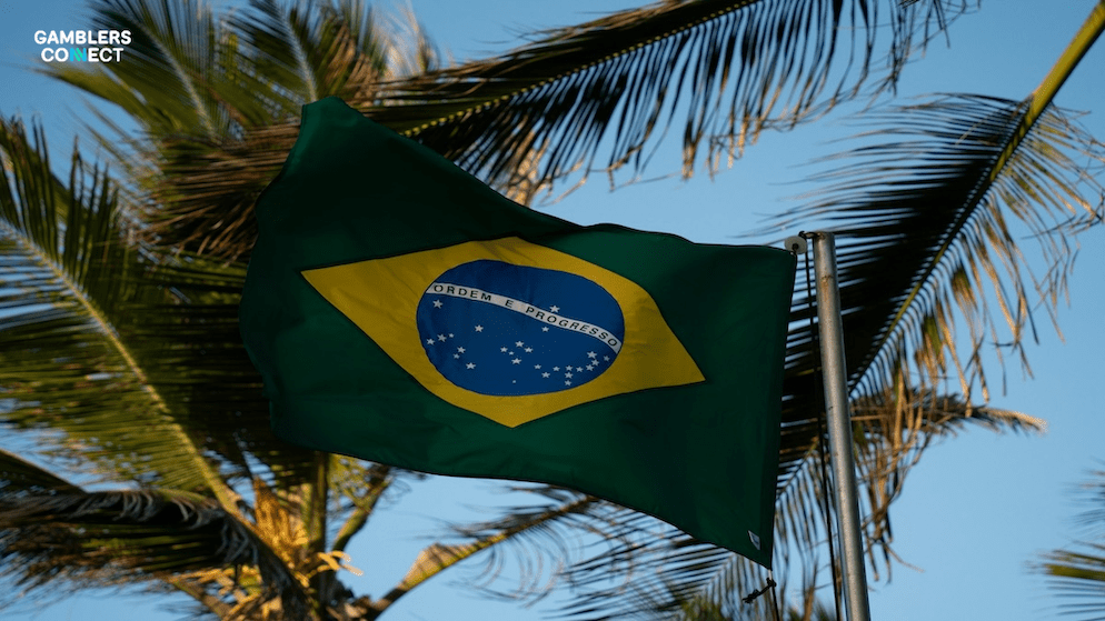 A graphic showing a smartphone with a betting interface connected to a government database (Sigap), illustrating the mandatory daily checks operators must perform to identify and block welfare recipients from gambling in Brazil.
