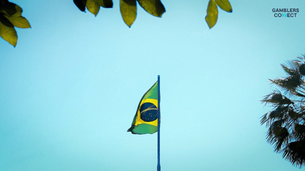 The Brazilian flag, representing the nation where Caixa Econômica Federal is launching its new fixed-odds betting platform, visible against a bright sky.