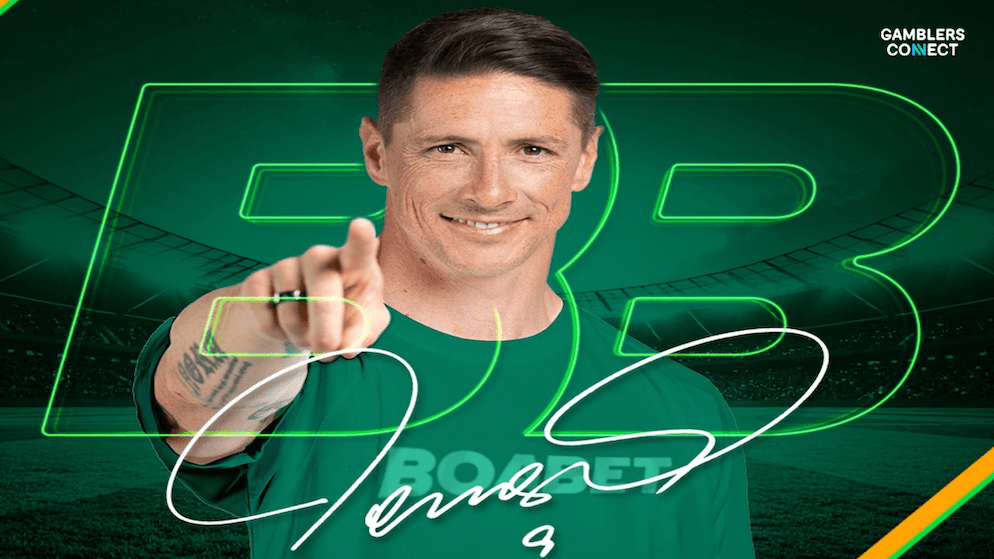 Fernando Torres smiling and pointing, endorsing BoaBet with a green background featuring the company's neon logo and his signature.