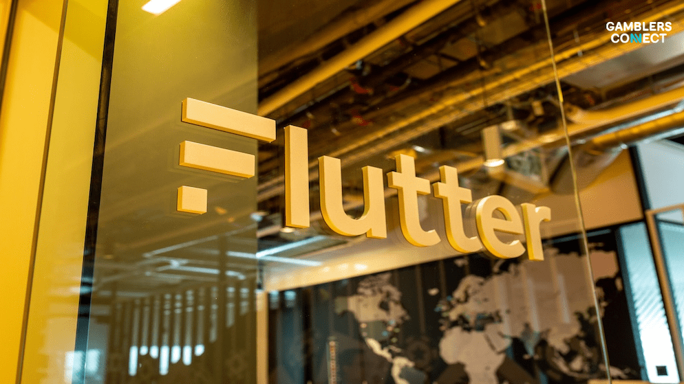 A modern office interior with the Flutter logo on a glass partition, representing Flutter Brazil's operations and focus on navigating the legal landscape.