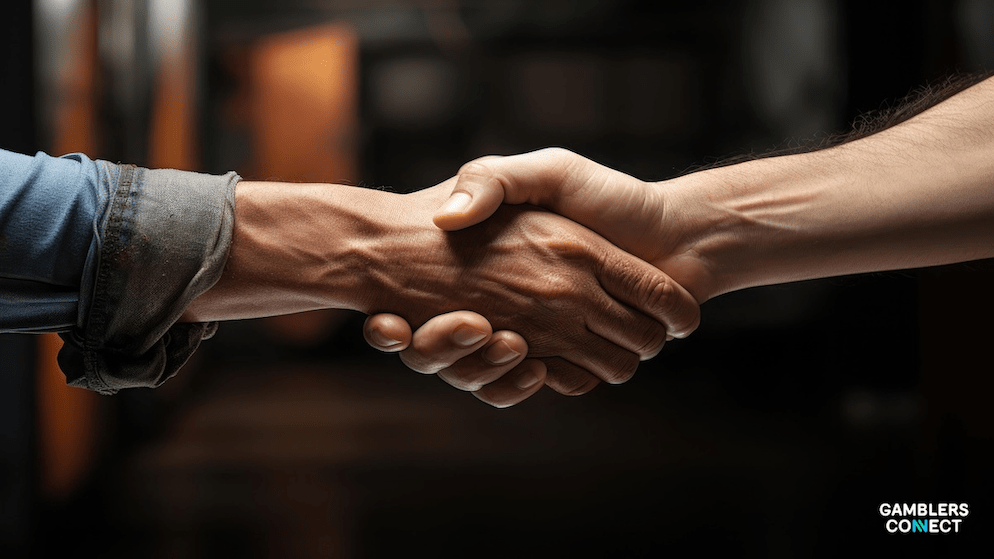 A close-up of ta handshake, symbolizing the new partnership between iGaming content supplier Galaxsys and app rental service Wild Wild Apps (WWA) to expand into the B2C segment.