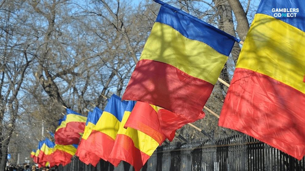 Multiple flags of Romania, representing the country's unified approach to integrate gambling and addiction topics into new high school subjects like Healthy Lifestyle and Psychological Self-Regulation.
