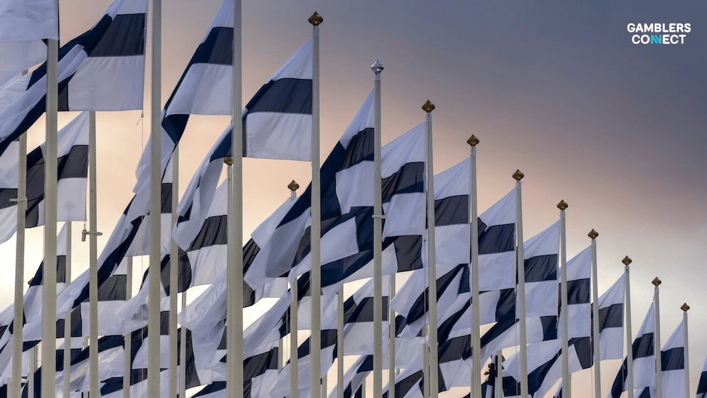 A row of Finnish national flags, indicating the country of Finland, where Blueprint Gaming has partnered with the state-owned operator Veikkaus.