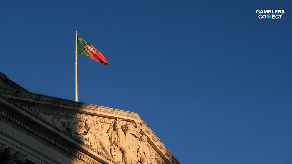 Close-up of the Portuguese flag on a building, representing the partnership between Booming Games and Placard.pt to bring certified slots to local players.