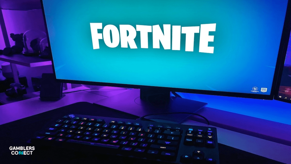 A glowing keyboard and monitor displaying the Fortnite logo, symbolizing the digital entry point for players seeking free tweaks for fortnite and high-value items.