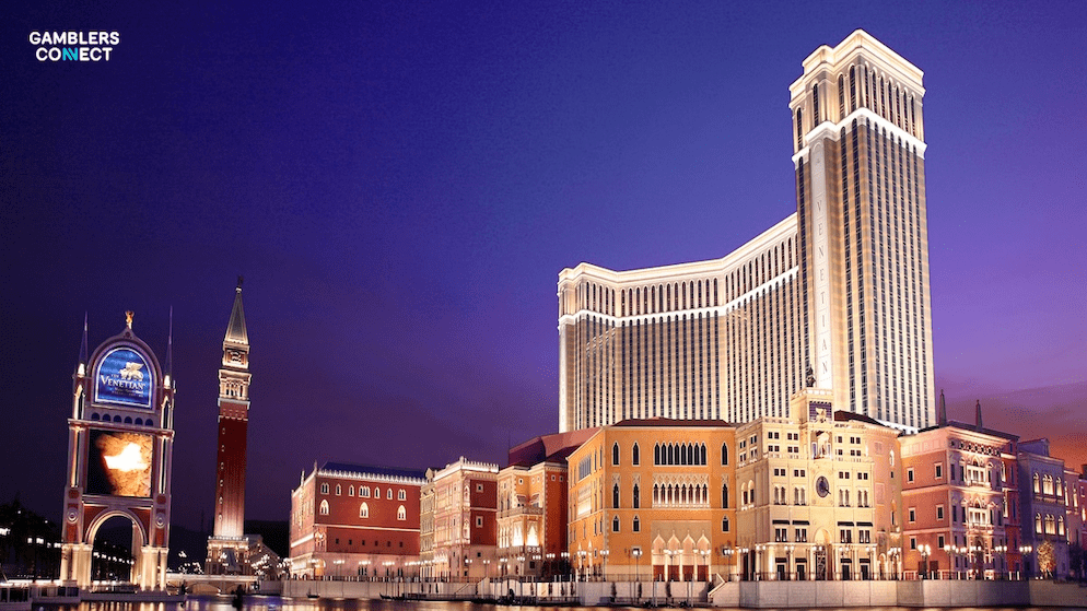 A stunning night view of a Sands China resort in Macau, representing the company's new partnership with the University of Macau to train staff in responsible gaming.