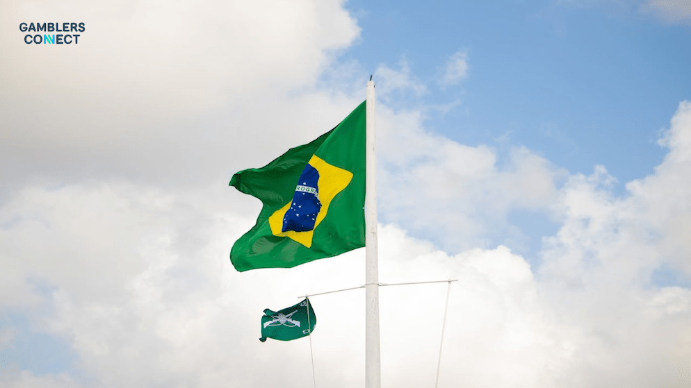 A flag of Brazil flying high, symbolizing the country's ongoing efforts to regulate the gaming sector and combat illegal operations.
