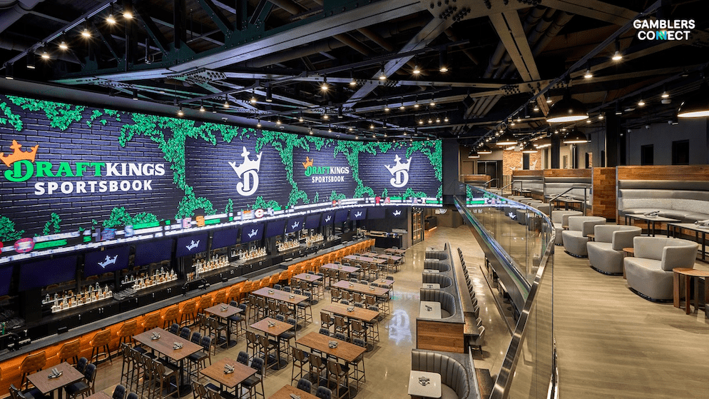 A smartphone displaying the DraftKings mobile app interface, illustrating the new native Spanish language navigation, betting markets, and account settings.