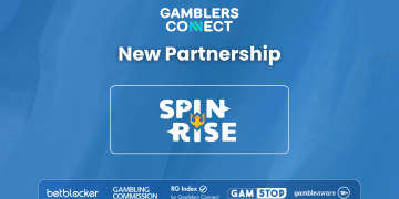 Promotional banner announcing "New Partnership" between Gamblers Connect and Spinrise Casino, showing both logos against a blue background with responsible gaming badges below.