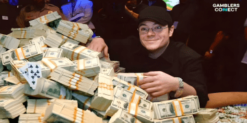 Jamie Gold smiling amidst massive piles of $100 bills, illustrating the extreme wealth achieved from poker Jamie Gold success.
