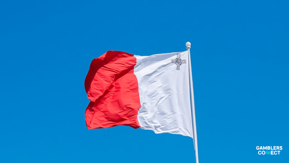 A flag of Malta flying on a pole, symbolizing the high standards of Public Notice enforced by the Malta Gaming Authority.