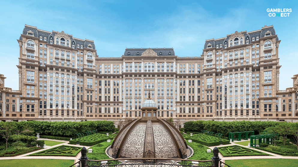 Wide shot of the Grand Lisboa Palace Resort Macau, showcasing its architecture and green spaces, representing SJM Resorts' role in Macau's tourism and MICE sector.