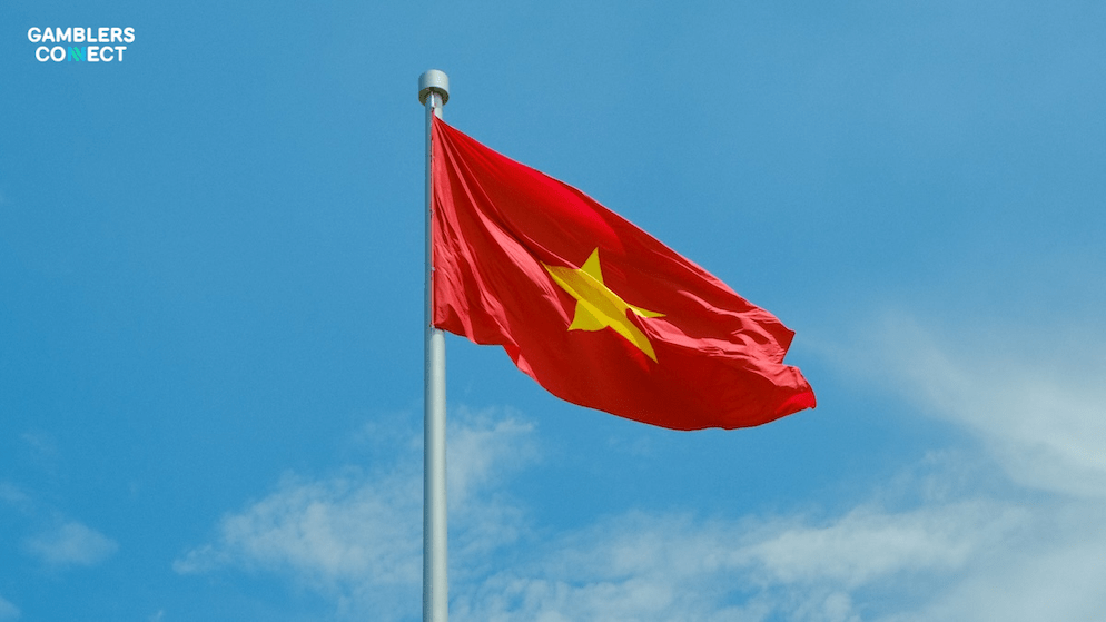 A close-up of casino chips and dice on a dark background, representing the growing revenue and modernization efforts within Vietnam's casino industry.