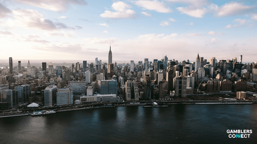 Two smartphones displaying the Caesars Palace Online Casino app, representing the dominance of mobile platforms in New York's betting handle.