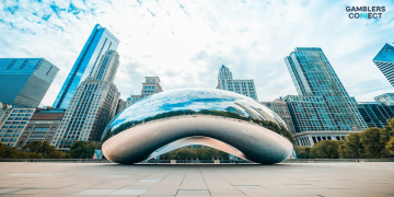 A wide-angle view of Cloud Gate (The Bean) and the Chicago city skyline under a blue sky, symbolizing the city's new fiscal measures.