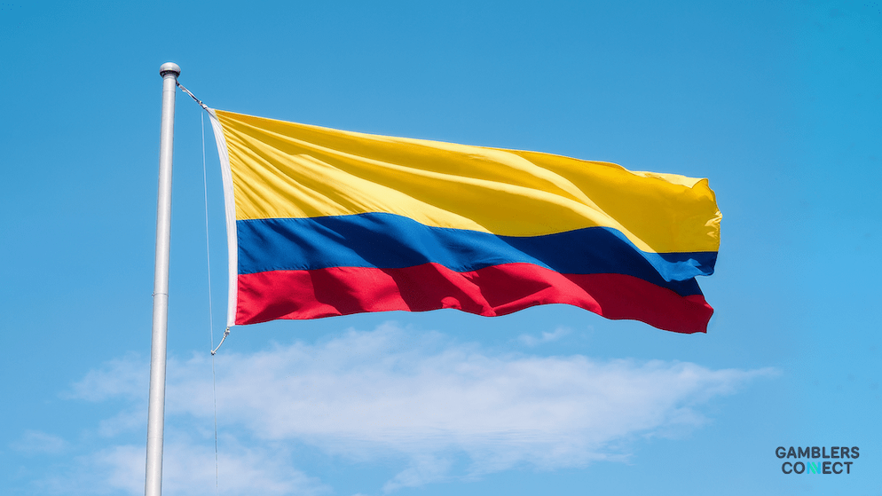 A vibrant Colombian flag flying high, representing the key Latin American market where Stakelogic is expanding its footprint.