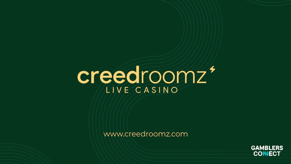 The official logo of CreedRoomz Live Casino in gold typography against a dark green background, announcing the launch of their new hybrid game.