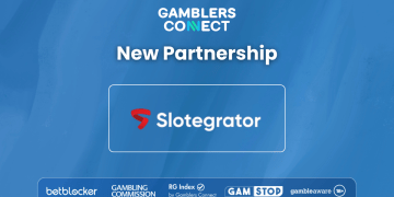 The corporate logos of Slotegrator and Gamblers Connect on a professional blue background, symbolizing a B2B media partnership.