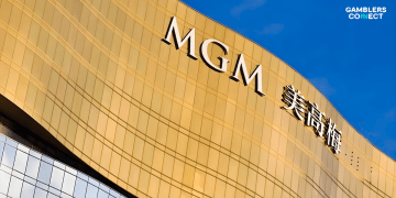 The golden facade of the MGM Macau resort building against a blue sky, representing the operator's leadership in the recent responsible gaming educational initiative.