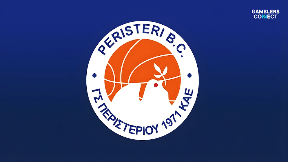 A wide-angle shot of the Peristeri indoor basketball arena, showcasing the new "Peristeri Betsson" branding on the parquet floor and LED perimeter boards.