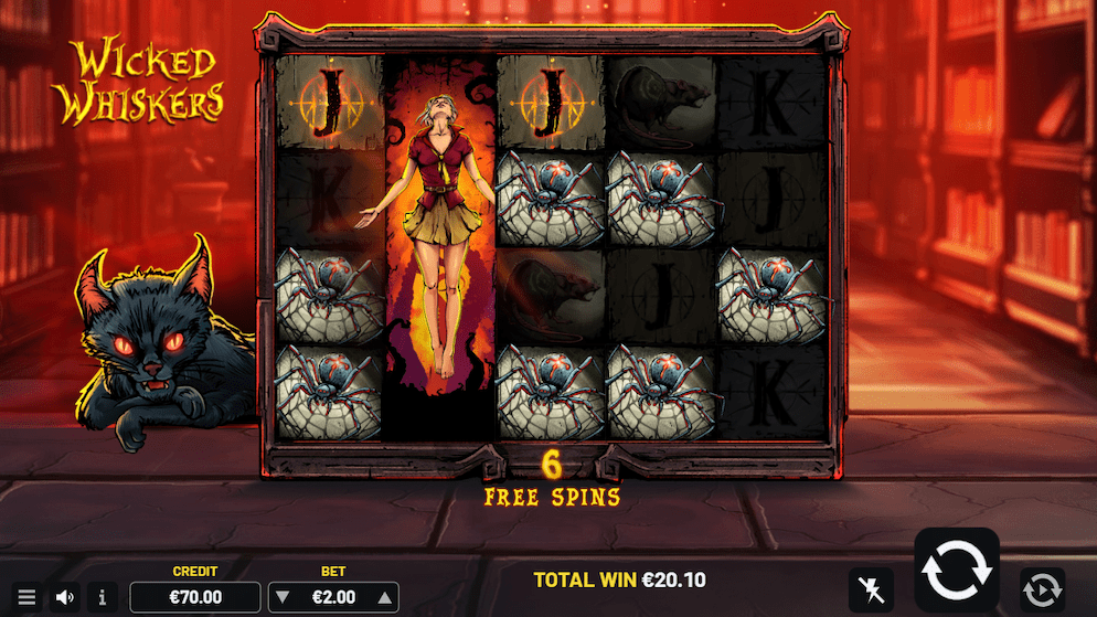Screenshot of the Wicked Whiskers slot during free spins, featuring an expanding wild symbol of a witch and the black cat character awake on the left.