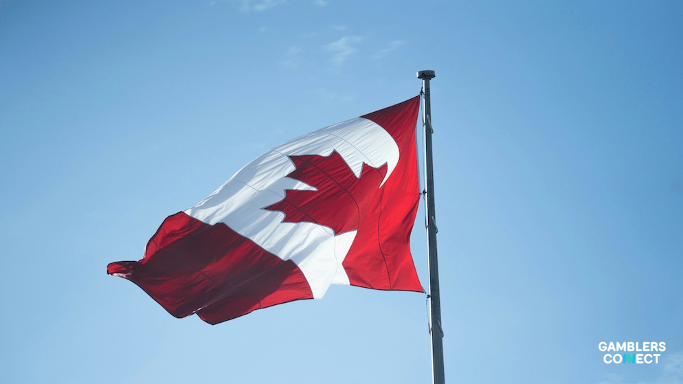 The flag of Canada highlighting the province of Alberta and its major cities like Edmonton and Calgary in the middle of the iGaming market regulation.