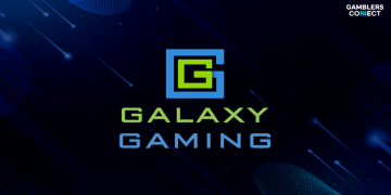 The official logo of Galaxy Gaming displayed in green and blue neon style on a dark background, announcing the launch of Monopoly Table Games Progressive in the UK.
