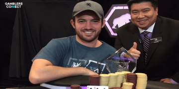 A young Joe Cada celebrating his record-breaking victory at the 2009 WSOP Main Event, surrounded by stacks of cash and the championship bracelet.