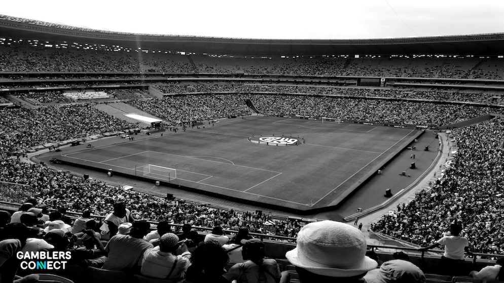 A crowd at a sports event in Africa, illustrating the projected $19.4 billion market growth as in the 2025 Sports Betting Integrity Report.