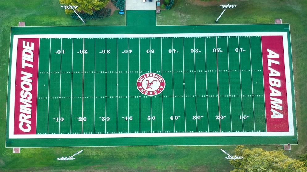 Aerial bird's-eye view of the Alabama Crimson Tide football field, representing the storied athletic tradition of the University of Alabama in Tuscaloosa.