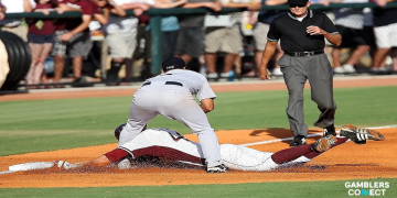 A high-stakes play during an Alabama vs Miami baseball game where a runner slides into base to beat a tag, illustrating the grit of the SEC vs ACC rivalry for 2026 predictions.